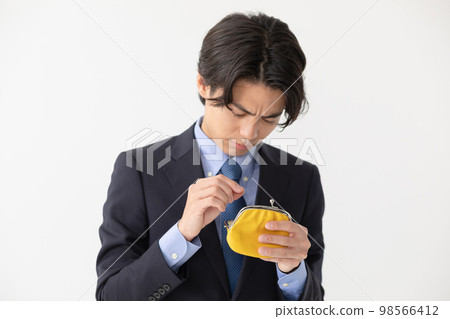 Businessman running out of money wallet clasp Businessman running out of money wallet clasp 98566412