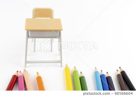A study desk with colored pencils and toys. Art class image 98566604