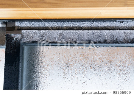 Resin sash of window with frozen condensation 98566909