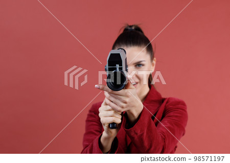 Woman with old vitage movie camera studio shot isolated. 98571197