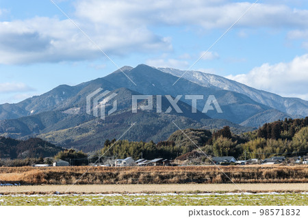 Mt. Shibi in winter, rice fields covered with snow Mt. Shibi in winter, rice fields covered with snow 98571832