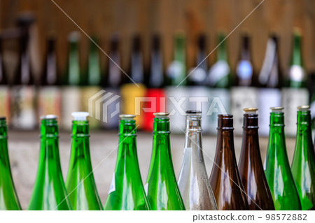 Empty 1.8-liter bottles lined up in front of an izakaya 98572882