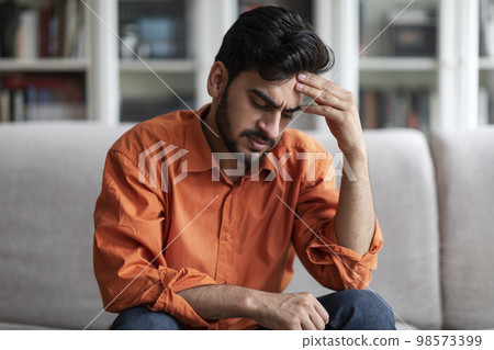 Upset middle eastern man experiencing lifetime crisis 98573399