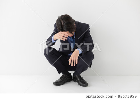 Businessman headache fever worry Businessman headache fever worry 98573959
