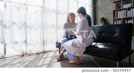 Home healthcare nurse, physical therapy with senior adult woman at home 98574457