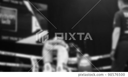 Blurred images black and white photo style of Thai boxing or Muay Thai or Kickboxing which local and foriegn boxer are fighting on the ring at indoor stage as martial art sport. Muay Thai Kick boxing Blurred images black and white photo style of Thai boxing or Muay Thai or Kickboxing which local and foriegn boxer are fighting on the ring at indoor stage as martial art sport. Muay Thai Kick boxing 98576500