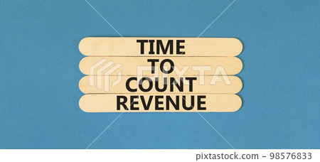 Time to count revenue symbol. Concept word Time to count revenue on wooden sticks. Beautiful blue table blue background. Business and time to count revenue concept. Copy space. Time to count revenue symbol. Concept word Time to count revenue on wooden sticks. Beautiful blue table blue background. Business and time to count revenue concept. Copy space. 98576833