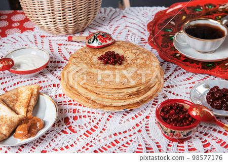Pancakes with berries and sour cream Pancakes with berries and sour cream 98577176