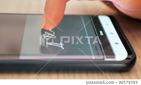 Electonic signature with finger in phone screen Electonic signature with finger in phone screen 98579393