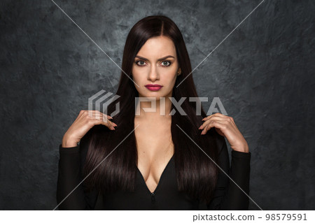 Beautiful woman with a deep neckline 98579591