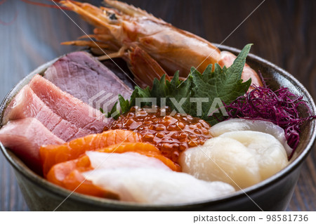 Bowl of rice topped with sashimi Bowl of rice topped with sashimi 98581736