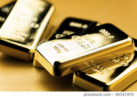 image photo of gold nuggets on a golden background 98581970