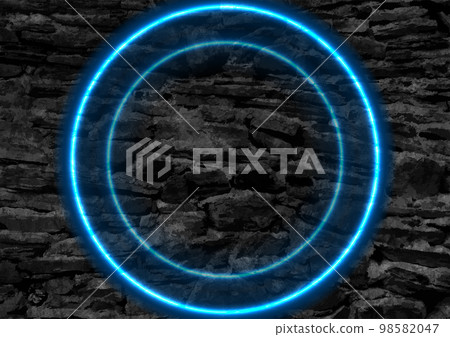 Blue glowing neon circles on black grunge stone wall 98582047