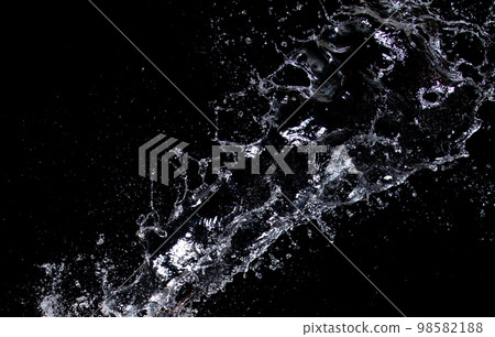 Shape form droplet of Water splashes into drop water attack fluttering in air and stop motion freeze shot. Splash Water for texture graphic resource elements, black background isolated 98582188