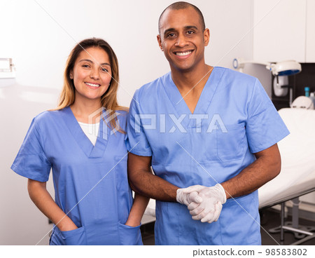 Two smiling beauticians in clinic of esthetic medicine 98583802