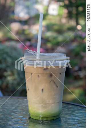 Iced coffee with nature background Iced coffee with nature background 98583876