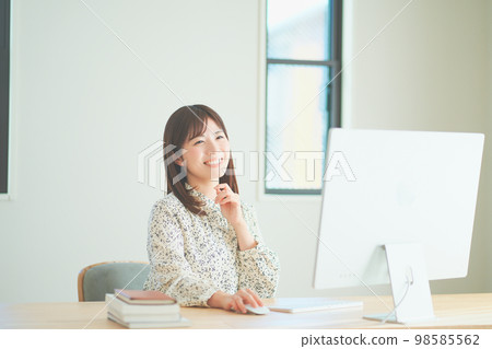A woman talking at a web conference A woman talking at a web conference 98585562