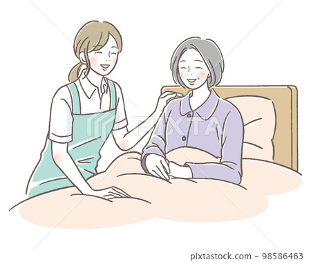 Caregiver woman smiling at senior woman in bed Caregiver woman smiling at senior woman in bed 98586463