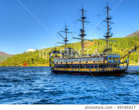 Hakone / Lake Ashinoko Hakone pirate ship Victory anchored at Motohakone Port overlooking Mt. Fuji / Hakone, Japan 98586827