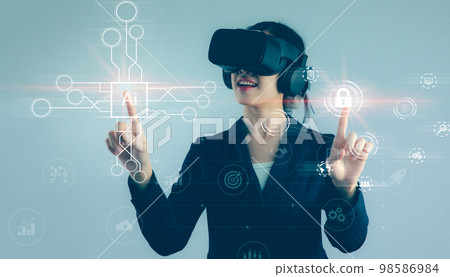 Asian businesswoman exploring virtual reality select the icon security and icon Ai on the virtual display. Business, technology, internet and networking concept.. Asian businesswoman exploring virtual reality select the icon security and icon Ai on the virtual display. Business, technology, internet and networking concept.. 98586984