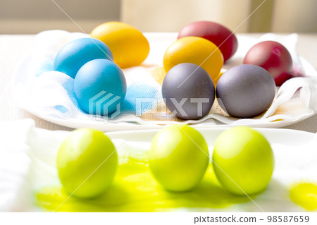 Painted eggs on the table after painting, a symbol of Easter, eggs Painted eggs on the table after painting, a symbol of Easter, eggs 98587659