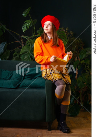 Preteen girl reading book Preteen girl reading book 98587868