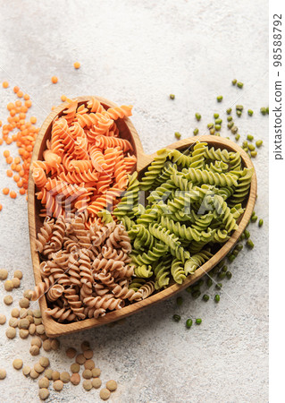 A variety of fusilli pasta from different types of legumes. Gluten-free pasta. A variety of fusilli pasta from different types of legumes. Gluten-free pasta. 98588792