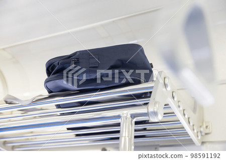 School bag image left on the train shelf 98591192