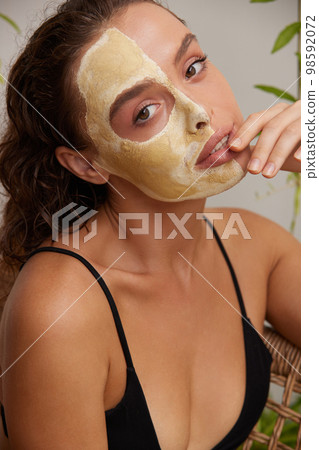 Face Mask Woman. Young Relaxed Woman Enjoying Skin Care Routine at Street 98592072