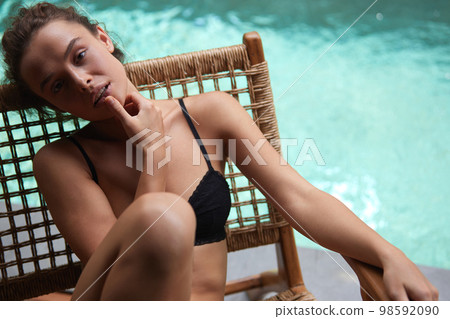 Sexy Woman In Bikini Sunbathing. Girl In Bikini Near Swimming Pool 98592090