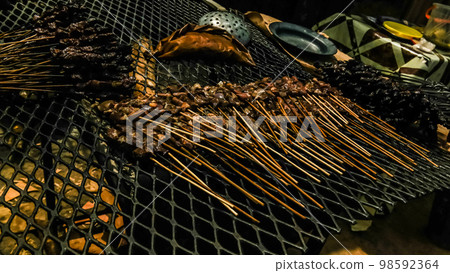 Close-up view to grilled meat as street food , Niamey, Niger Close-up view to grilled meat as street food , Niamey, Niger 98592364