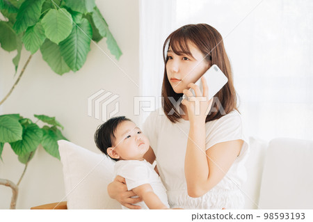 Mother calling the hospital with her sick baby 98593193