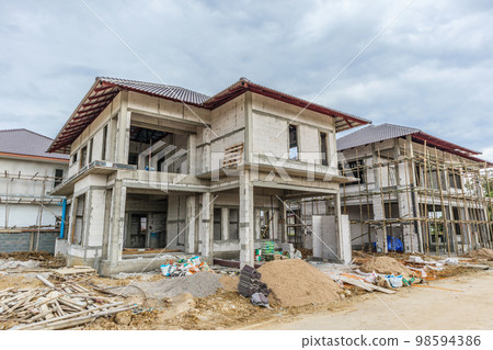 construction residential new house in progress at building site construction residential new house in progress at building site 98594386