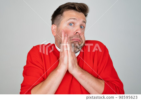 Mature man looking serious showing open palm making stop gesture Mature man looking serious showing open palm making stop gesture 98595623