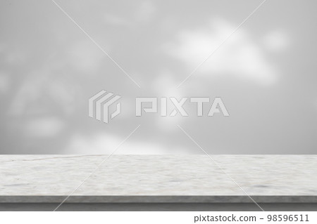Marble table with tree shadow drop on white wall background for mockup product display 98596511
