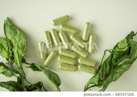 Herbal medicine capsules with Andrographis paniculata leaf on white background Herbal medicine capsules with Andrographis paniculata leaf on white background 98597108