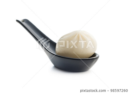 Xiaolongbao, traditional steamed dumplings in spoon. Xiao Long Bao buns isolated on white background. 98597260