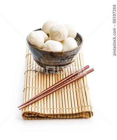 Xiaolongbao, traditional steamed dumplings in bowl. Xiao Long Bao buns isolated on white background. 98597268