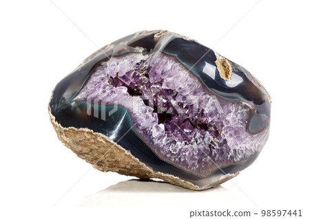 Macro Mineral Stone Amethysts in the rock on a white background 98597441