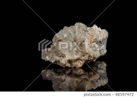 Macro mineral stone fluorite with quartz against black background Macro mineral stone fluorite with quartz against black background 98597472