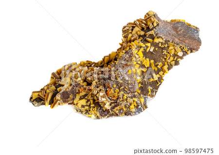 Macro mineral stone yellow Wulfenite on a white background 98597475
