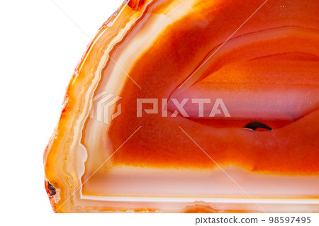 Macro mineral orange agate in crystals on white background 98597495