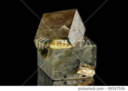 Macro mineral stone Pyrite on a black background 98597506