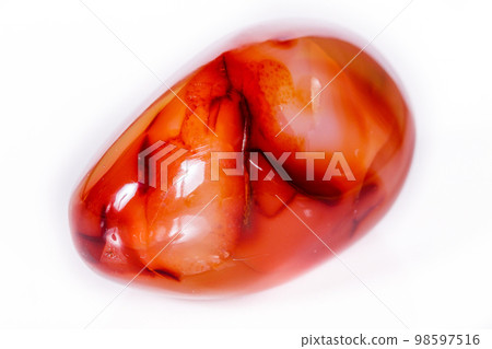 Macro mineral stone Carnelian on white background Macro mineral stone Carnelian on white background 98597516