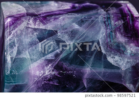Macro mineral stone Fluorite crystal on a black background Macro mineral stone Fluorite crystal on a black background 98597521