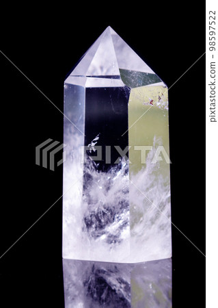 Macro mineral stone Crystal rock crystal on a black background 98597522