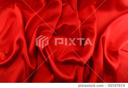 Red silk fabric background closeup Red silk fabric background closeup 98597654