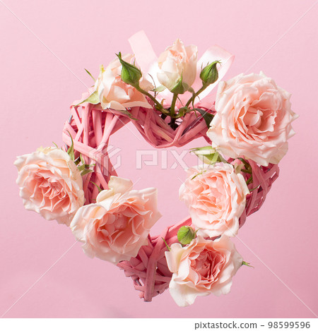 A close-up of a valentine made of braided hearts and roses on Valentine's Day. 98599596