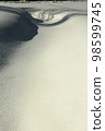 A picture of snow. Expressing shadows with a lot of snow and a little 98599745