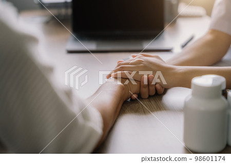 Female doctors shake hands with patients encouraging each other To offer love, concern, and encouragement while checking the patient's health. concept of medicine. Female doctors shake hands with patients encouraging each other To offer love, concern, and encouragement while checking the patient's health. concept of medicine. 98601174